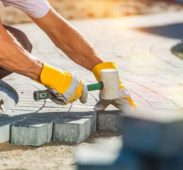 A person with gloves on working on the ground A person with gloves on working on the ground